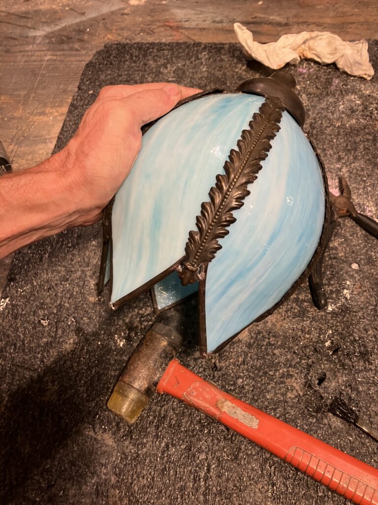 Blue slag glass shade after repairs